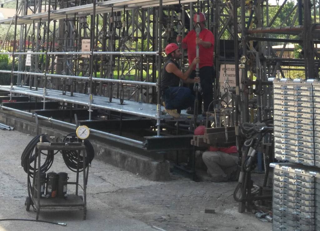 Scaffolding Test and Certification - workers testing scaffolding