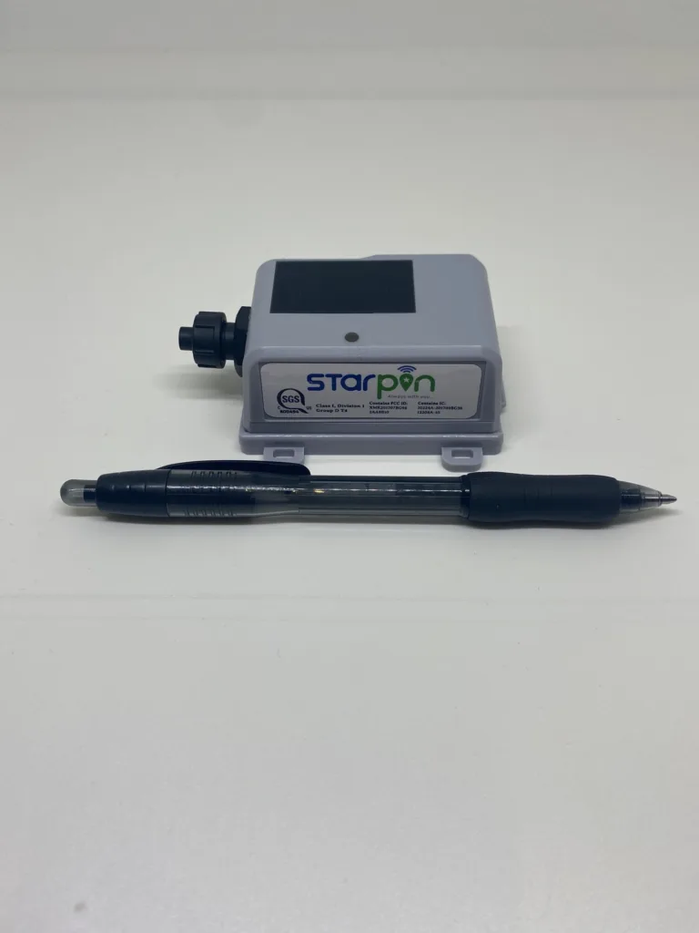Tank Level Monitor product against pen to show small size