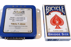 High Resolution 1553 and ARINC thunderbolt avionics interface card against a pack of cards